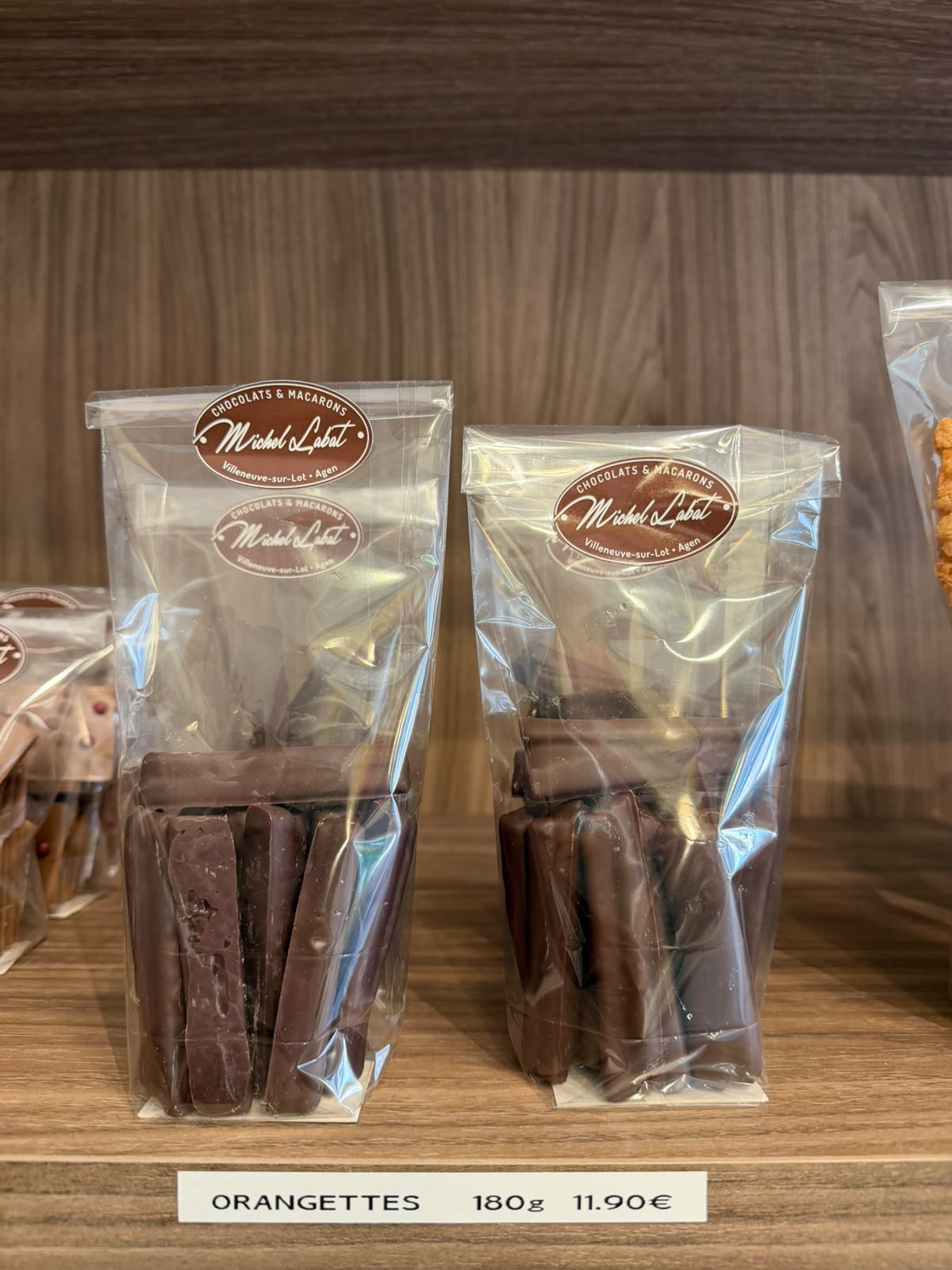 Orangettes 180 g — Écorces d'orange confites enrobées de chocolat noir.
