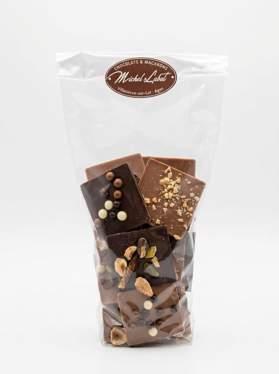 Assortiment de palets 300 g — Sélection de palets garnis : pistaches, éclats, perles craquantes et fruits secs.