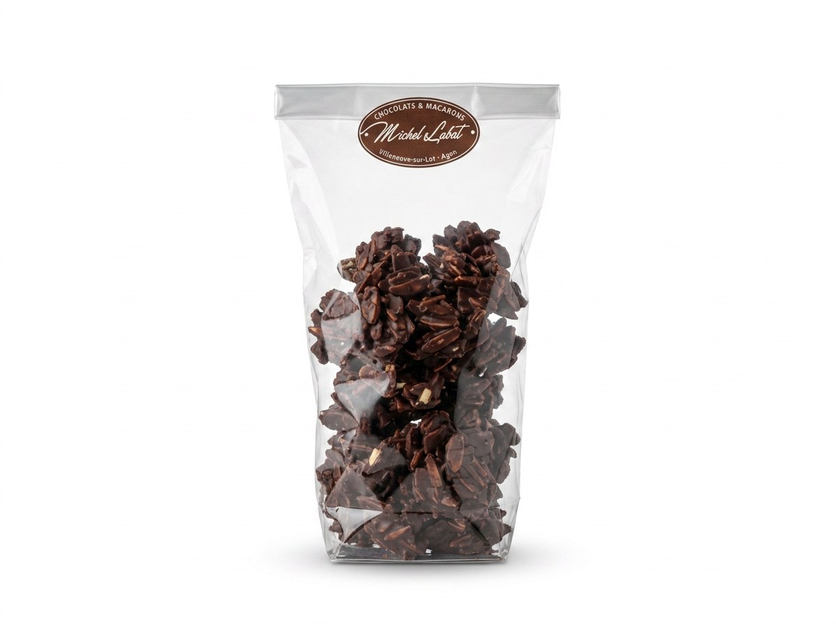 Rochers 200 g (lait ou noir) — Éclats d'amandes caramélisées enrobés de chocolat lait ou noir.