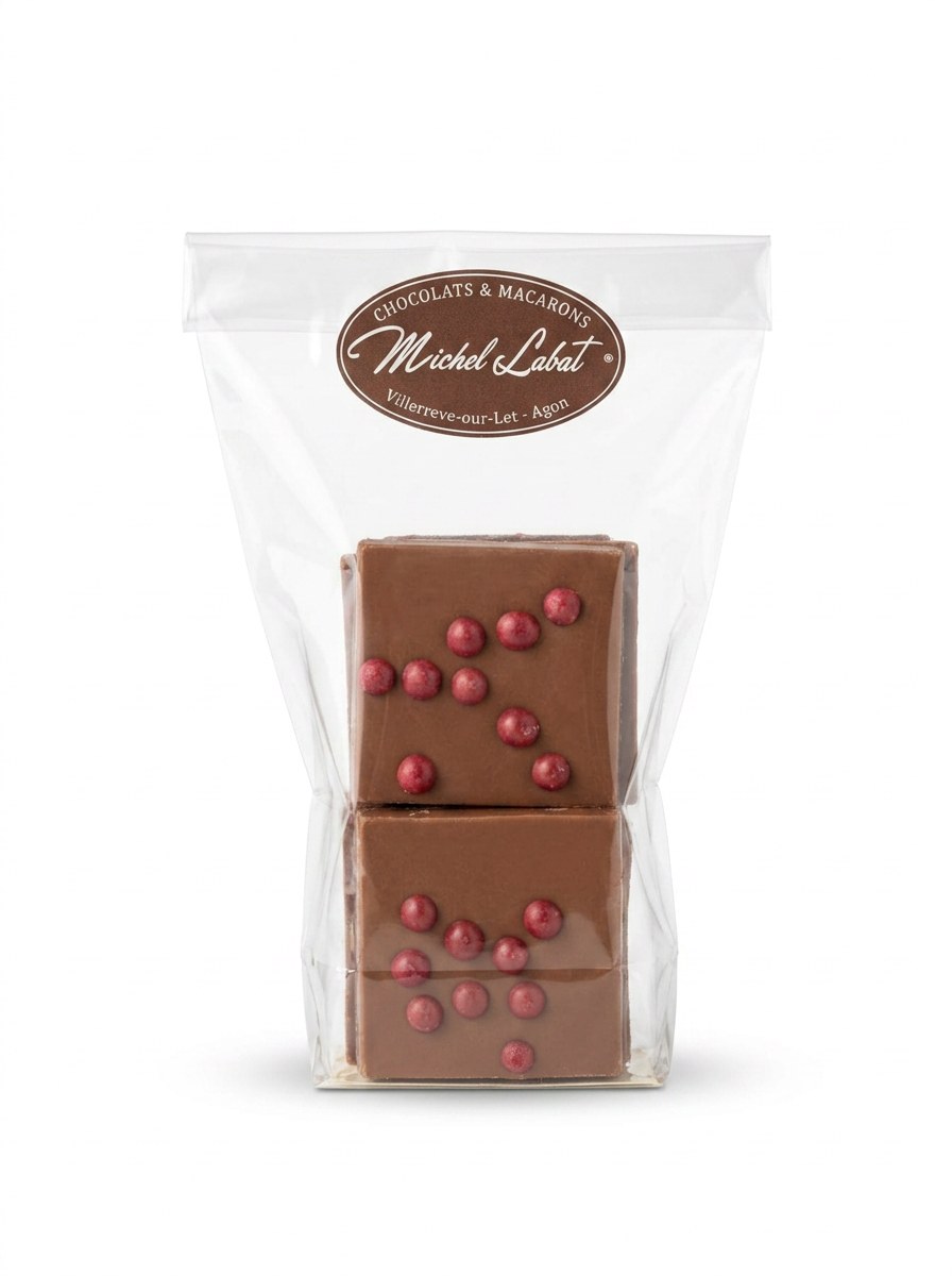 Palets framboises 120 g — Chocolat noir ou lait aux éclats de framboise.
